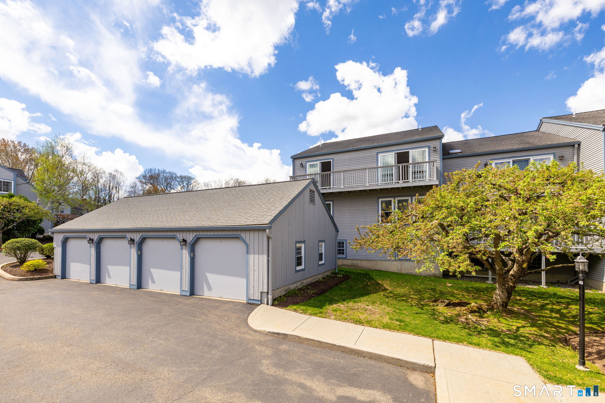 85 Gate Ridge Road, Unit 85 Fairfield, CT 06825 - Photo 33 of 38 Garage bay is third from right