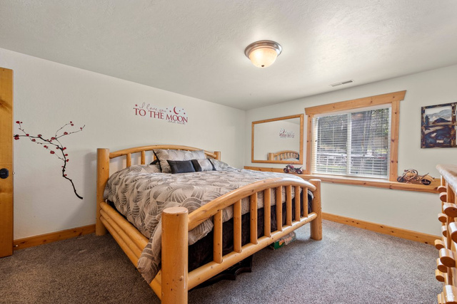 288 South Hillside Drive Elk Ridge, UT 84651 - Photo 17 of 27 Bedroom featuring custom woodwork and nice window with shelf in wall