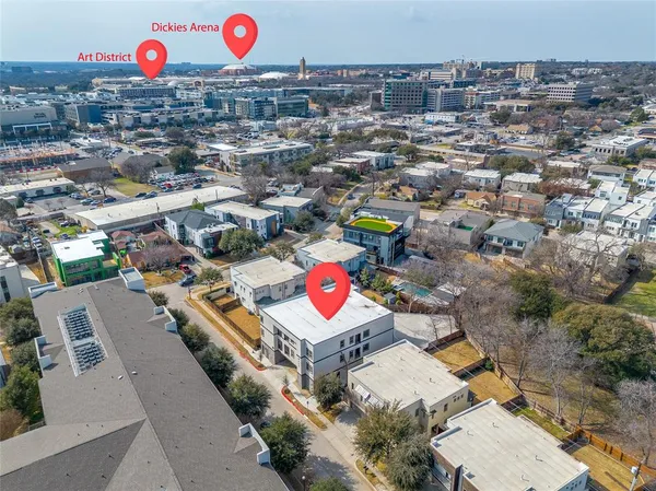 an aerial view of residential houses with outdoor space