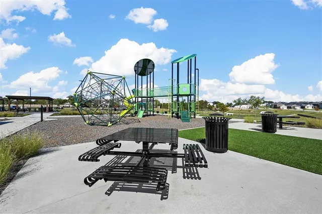 a view of a swimming pool and lounge chairs