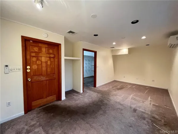 an empty room with closet area