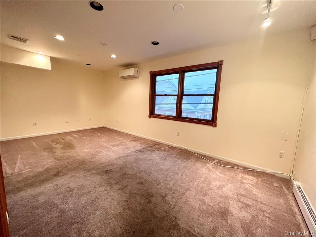 26 Wallkill Avenue, Unit 2 Wallkill, NY 12589 - Photo 7 of 13 an empty room with a window