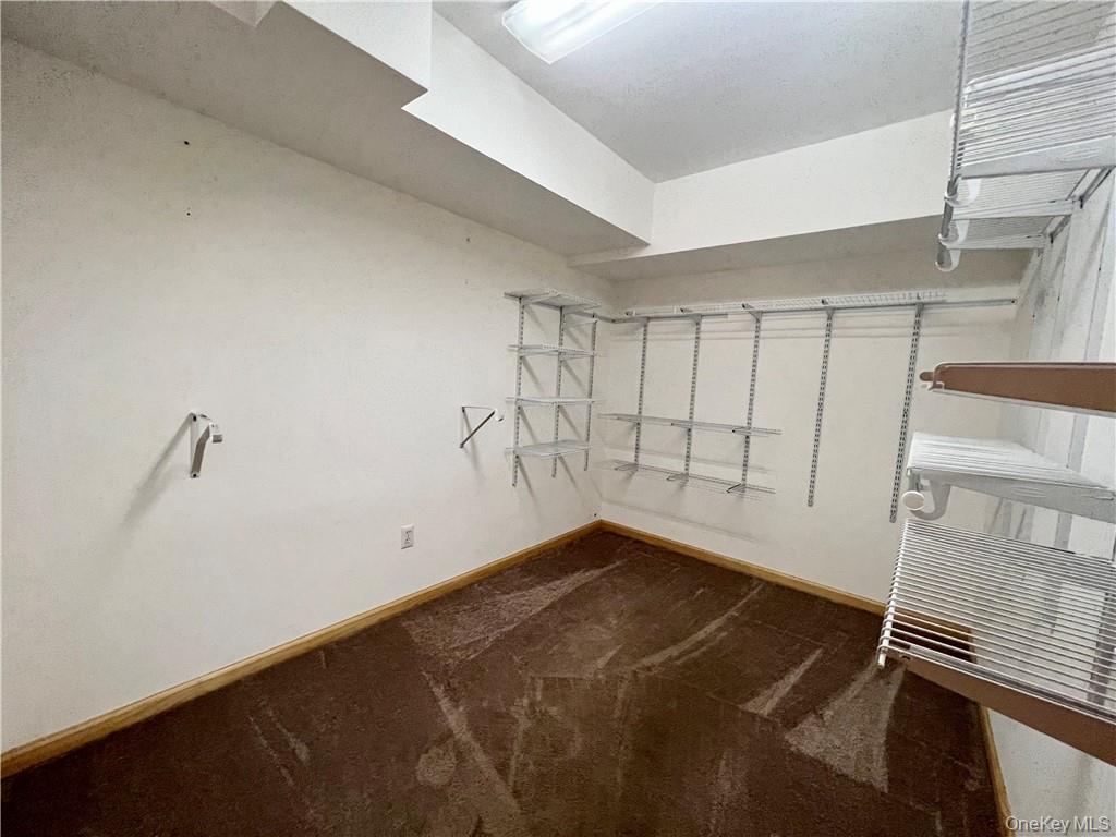 26 Wallkill Avenue, Unit 2 Wallkill, NY 12589 - Photo 8 of 13 a view of a room with rack on the wall