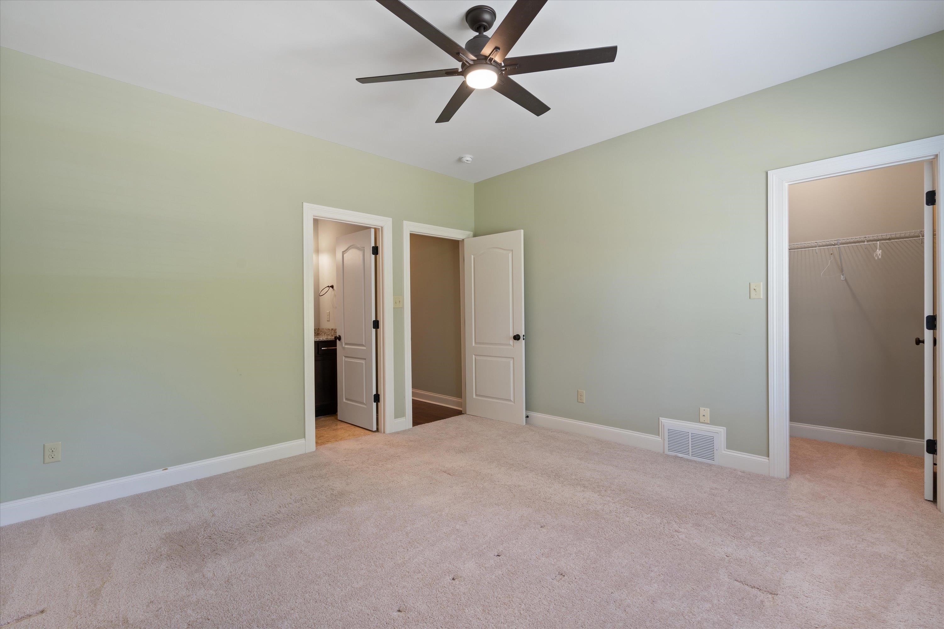 5168 Barry Road Memphis, TN 38117 - Photo 18 of 25 a view of a room with a ceiling fan and closet