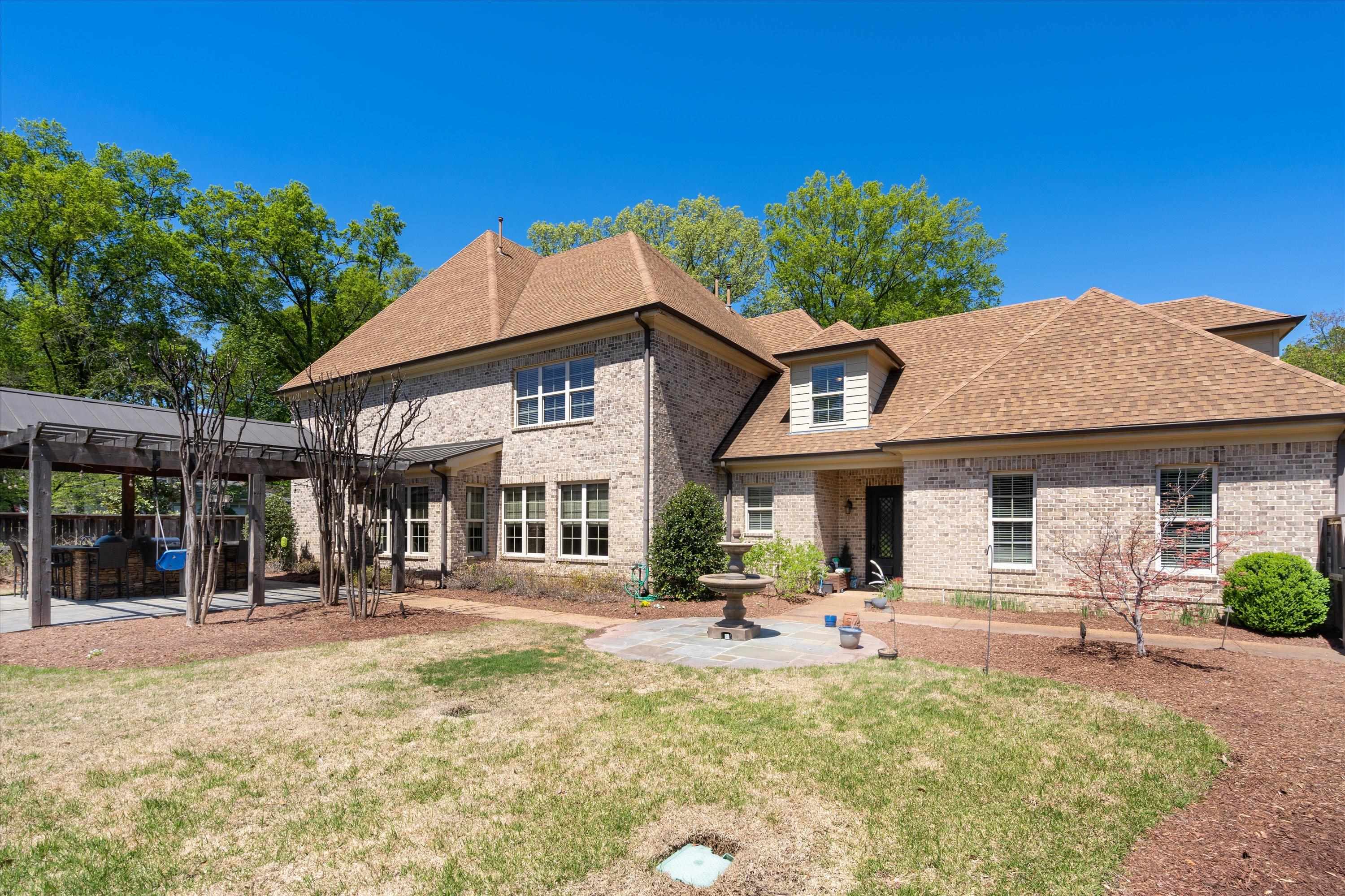 5168 Barry Road Memphis, TN 38117 - Photo 23 of 25 a front view of a house with a yard