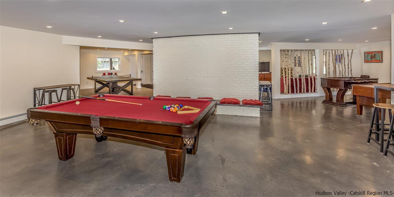 96 Lake Road Hunter, NY 12442 - Photo 15 of 35 a room with furniture pool table gym equipment wooden floor and windows