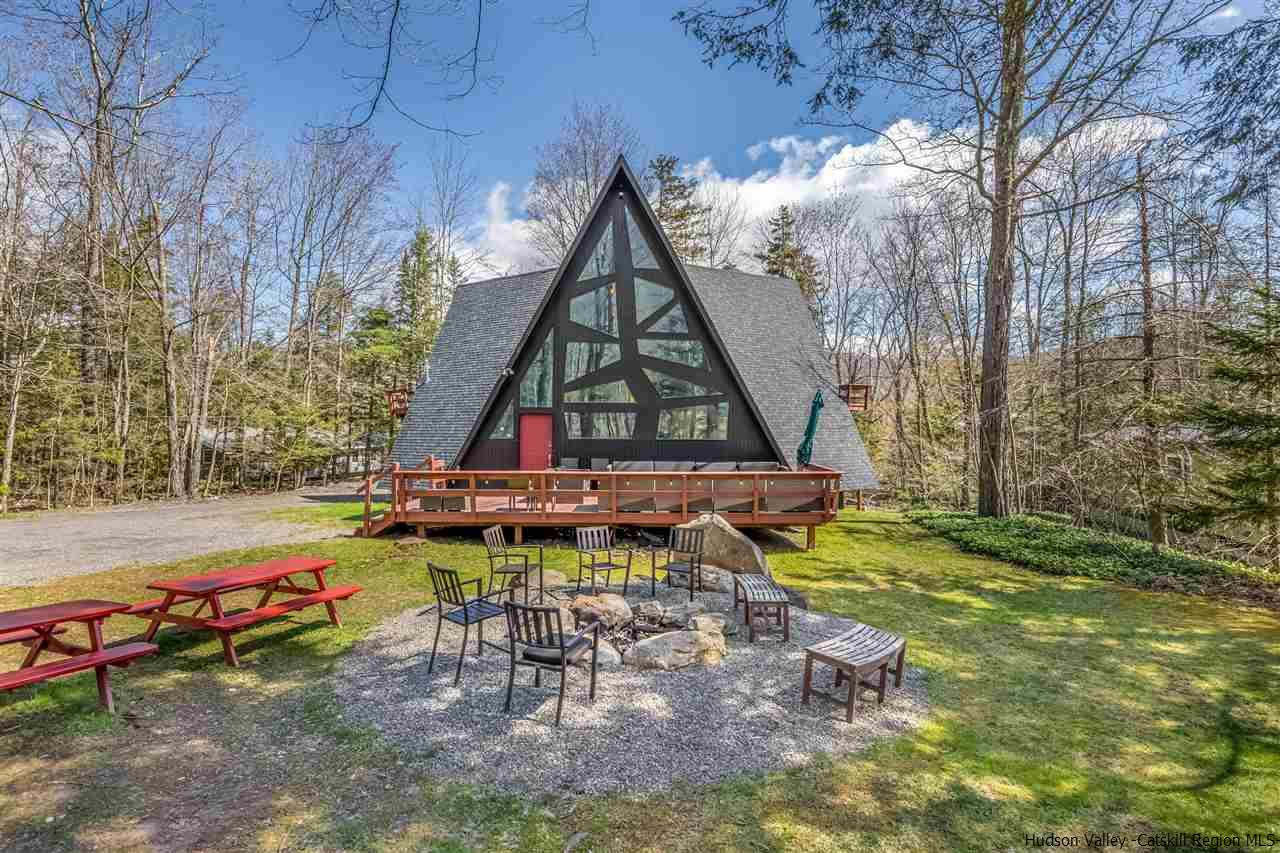 96 Lake Road Hunter, NY 12442 - Photo 2 of 35 a view of playground with a slide and swing