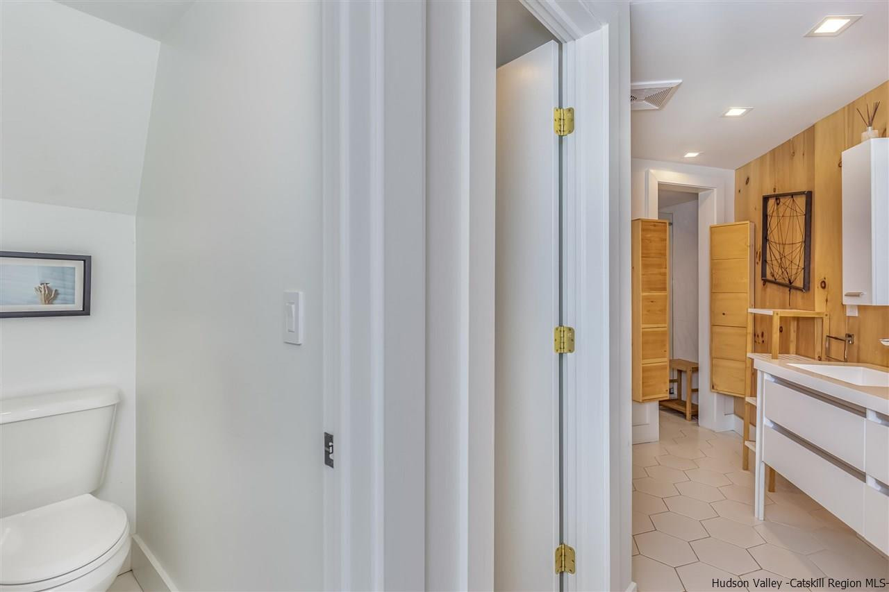 96 Lake Road Hunter, NY 12442 - Photo 21 of 35 a bathroom with a toilet and a shower