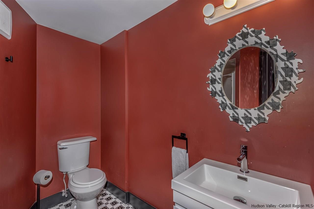 96 Lake Road Hunter, NY 12442 - Photo 26 of 35 a bathroom with a toilet and sink