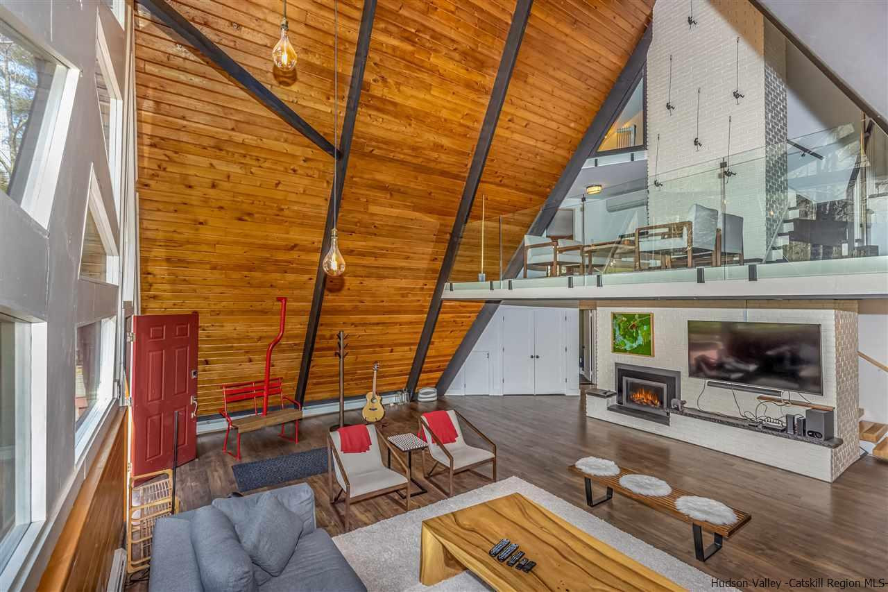 96 Lake Road Hunter, NY 12442 - Photo 10 of 35 a outdoor living space with patio furniture and a fireplace