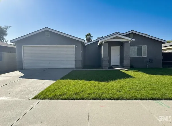 a front view of a house with yard