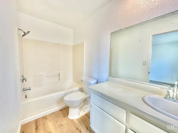 a bathroom with a sink a toilet and a bathtub