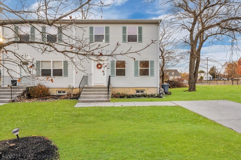 348 Silk Street Lawnside, NJ 08045 - Photo 1 of 24 a front view of a house with a garden and yard