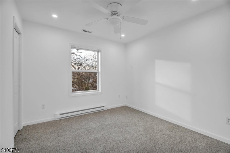 348 Silk Street Lawnside, NJ 08045 - Photo 15 of 24 an empty room with a window