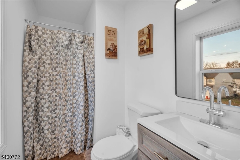 348 Silk Street Lawnside, NJ 08045 - Photo 17 of 24 a bathroom with a sink toilet and shower