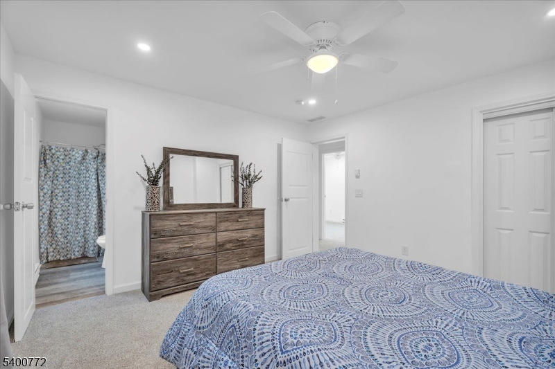 348 Silk Street Lawnside, NJ 08045 - Photo 21 of 24 a bedroom with a bed and a dresser