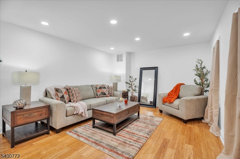 348 Silk Street Lawnside, NJ 08045 - Photo 9 of 24 a living room with furniture and a wooden floor
