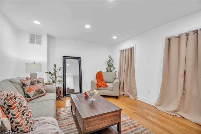 348 Silk Street Lawnside, NJ 08045 - Photo 10 of 24 a bedroom with furniture and a window