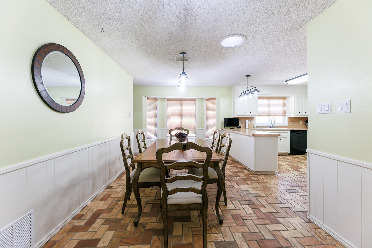 3713 95th Street Lubbock, TX 79423 - Photo 15 of 70 a view of a dining room with furniture and a kitchen