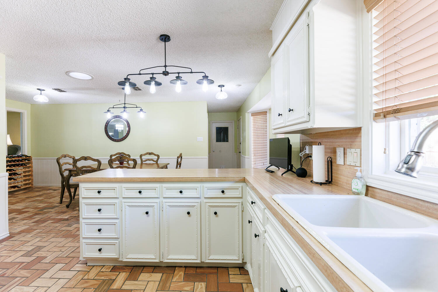 3713 95th Street Lubbock, TX 79423 - Photo 19 of 70 a spacious bathroom with a granite countertop sink and a large mirror