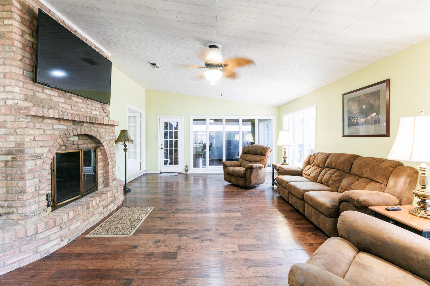 3713 95th Street Lubbock, TX 79423 - Photo 29 of 70 a living room with furniture and a fireplace