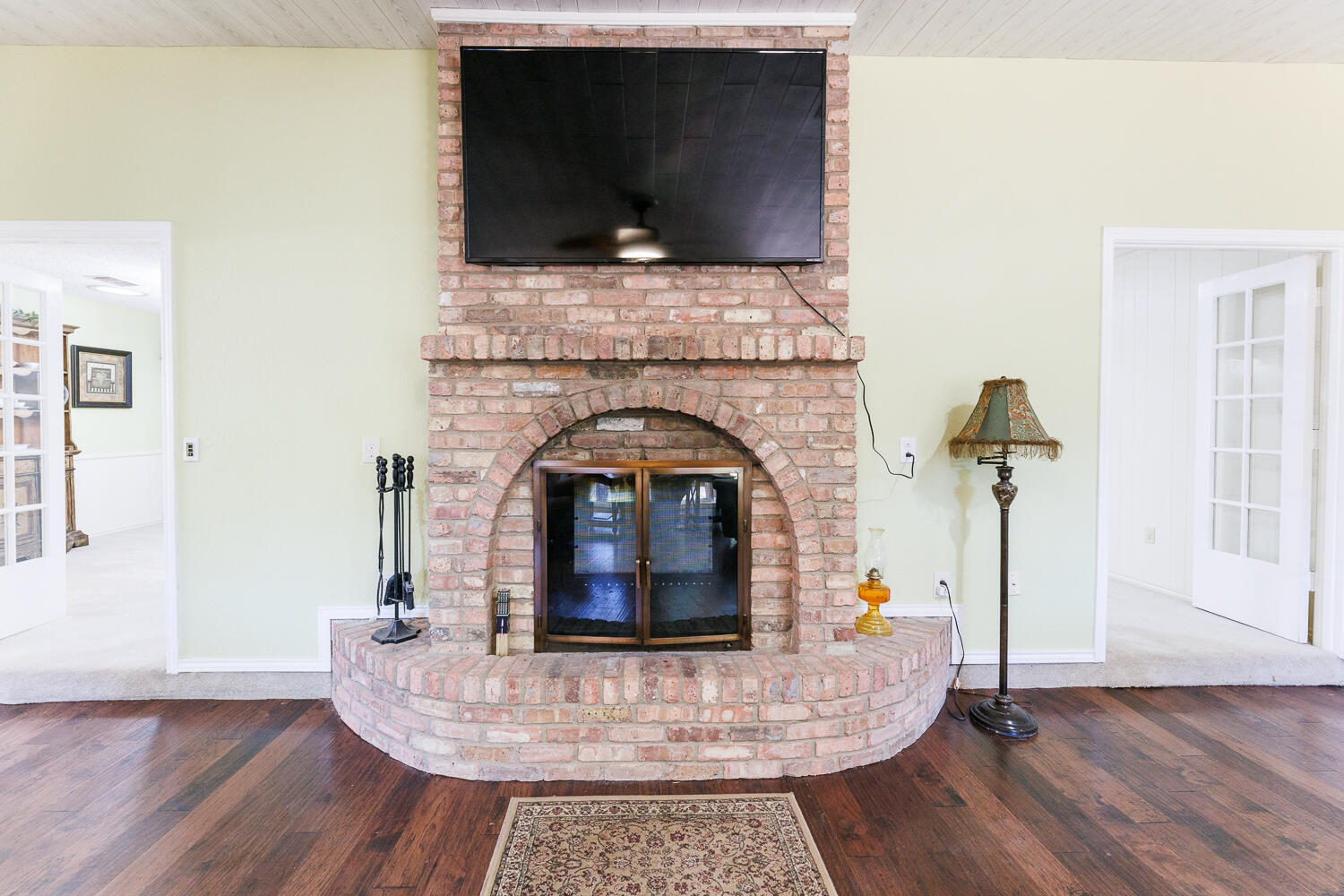 3713 95th Street Lubbock, TX 79423 - Photo 30 of 70 a living room with fireplace furniture and a flat screen tv
