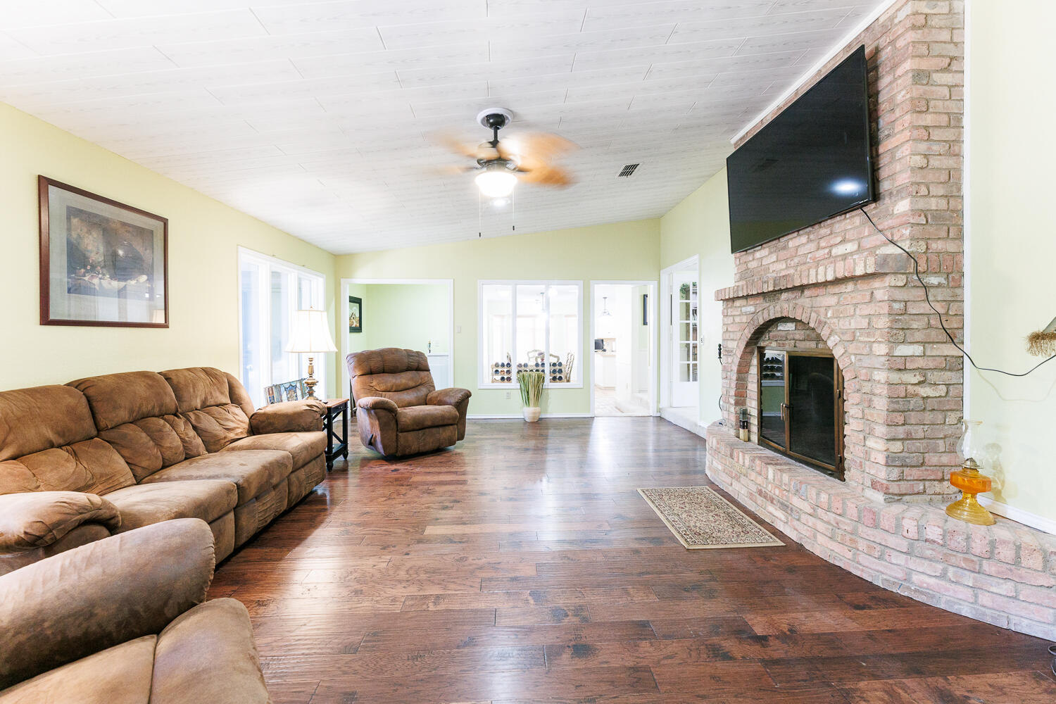 3713 95th Street Lubbock, TX 79423 - Photo 31 of 70 a living room with furniture and a fireplace