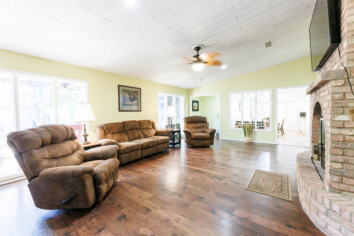 3713 95th Street Lubbock, TX 79423 - Photo 32 of 70 a living room with furniture and a wooden floor