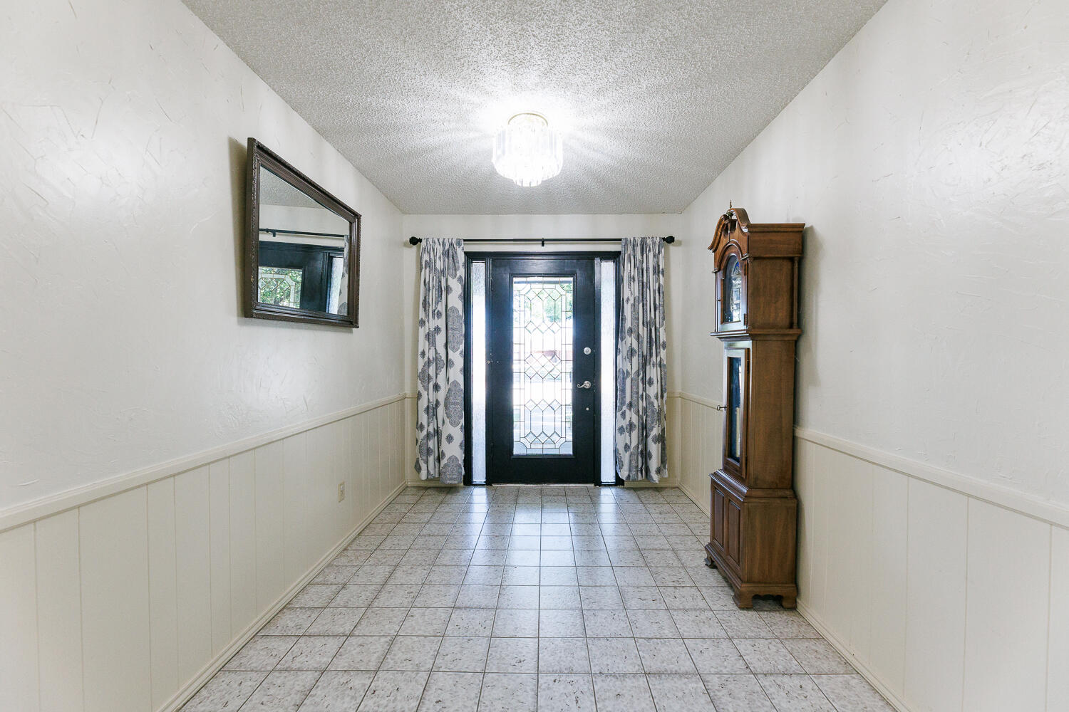 3713 95th Street Lubbock, TX 79423 - Photo 4 of 70 a view of a hallway with an entryway