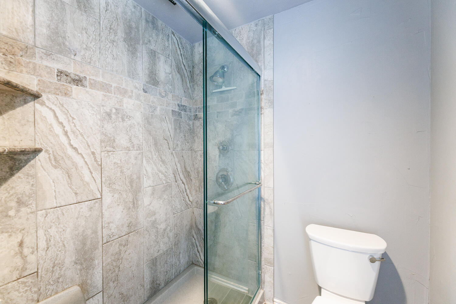 3713 95th Street Lubbock, TX 79423 - Photo 41 of 70 a bathroom with a toilet and a shower