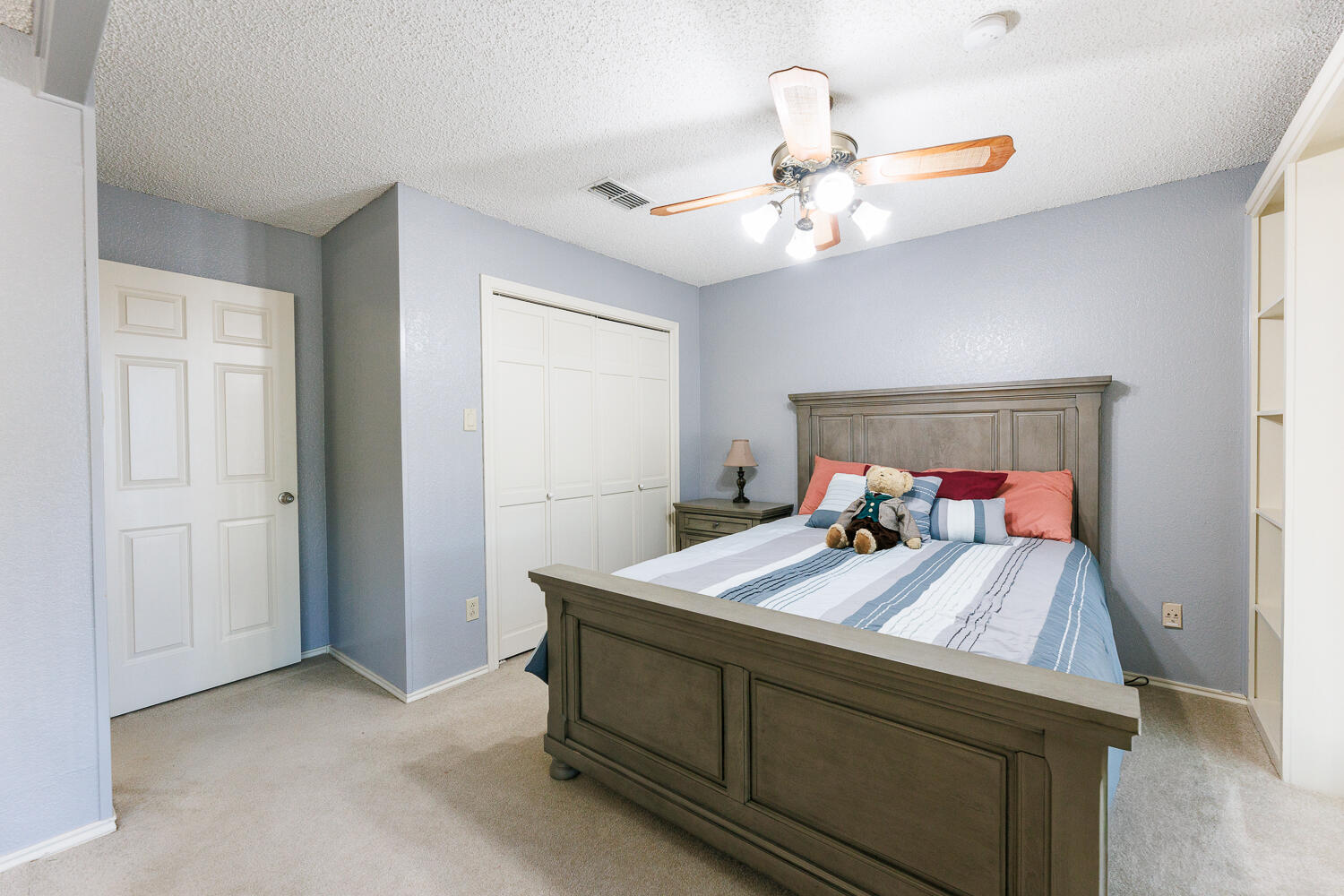 3713 95th Street Lubbock, TX 79423 - Photo 45 of 70 a bed room with a bed and a chandelier
