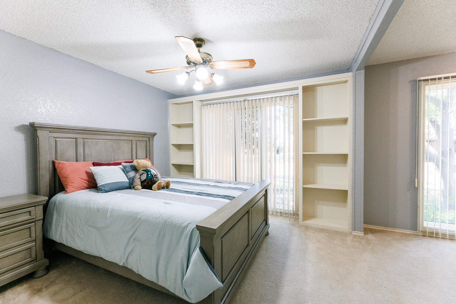 3713 95th Street Lubbock, TX 79423 - Photo 46 of 70 a bedroom with a bed and a chandelier