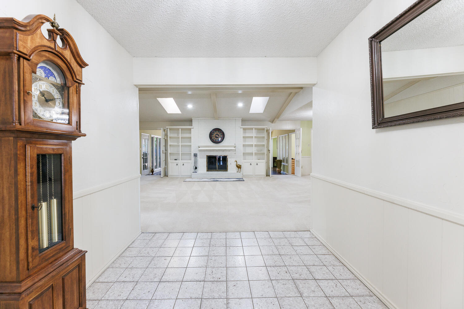 3713 95th Street Lubbock, TX 79423 - Photo 5 of 70 a view of a hallway with entryway wooden floor and livingroom view