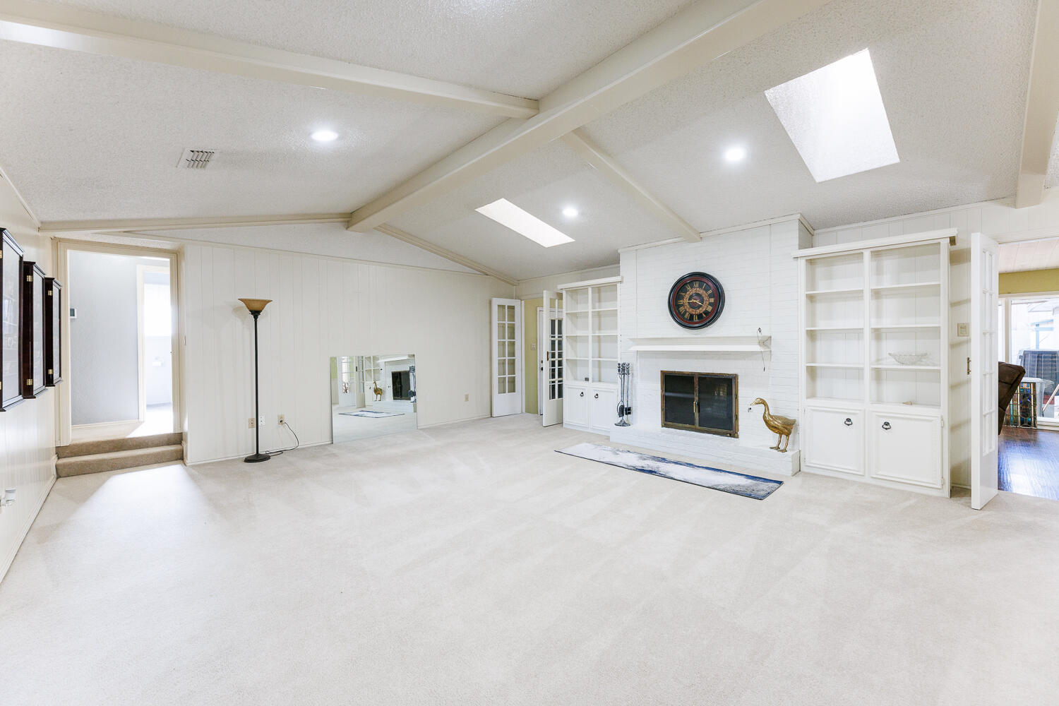 3713 95th Street Lubbock, TX 79423 - Photo 6 of 70 a view of empty room with a fireplace and window