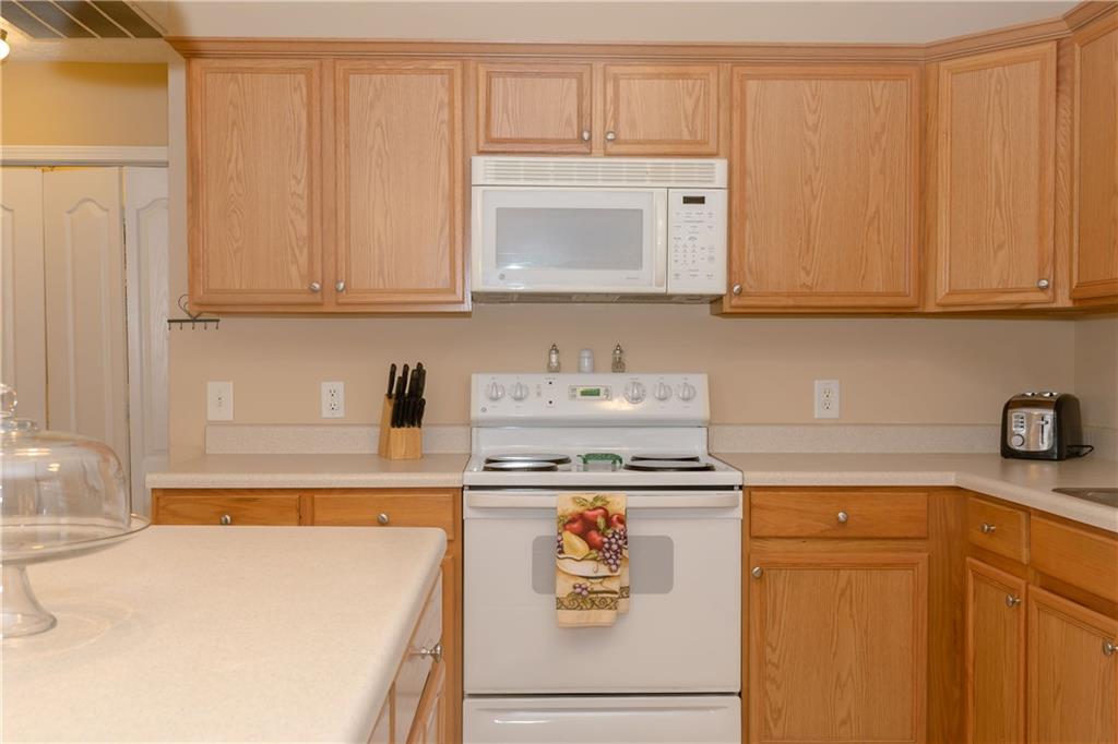 1200 Breckinridge Trail Winder, GA 30680 - Photo 11 of 37 a kitchen with granite countertop cabinets stainless steel appliances and a sink