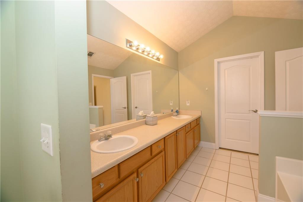 1200 Breckinridge Trail Winder, GA 30680 - Photo 20 of 37 a bathroom with a double vanity sink and a mirror