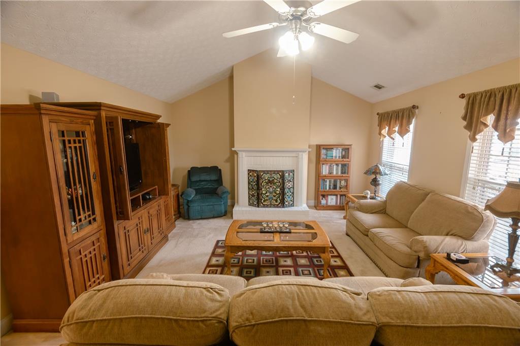 1200 Breckinridge Trail Winder, GA 30680 - Photo 2 of 37 a bedroom with furniture and a flat screen tv