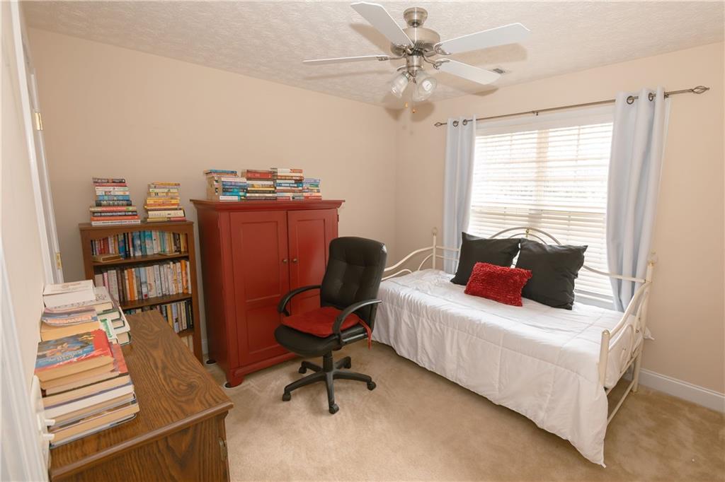 1200 Breckinridge Trail Winder, GA 30680 - Photo 21 of 37 a bedroom with furniture and a window