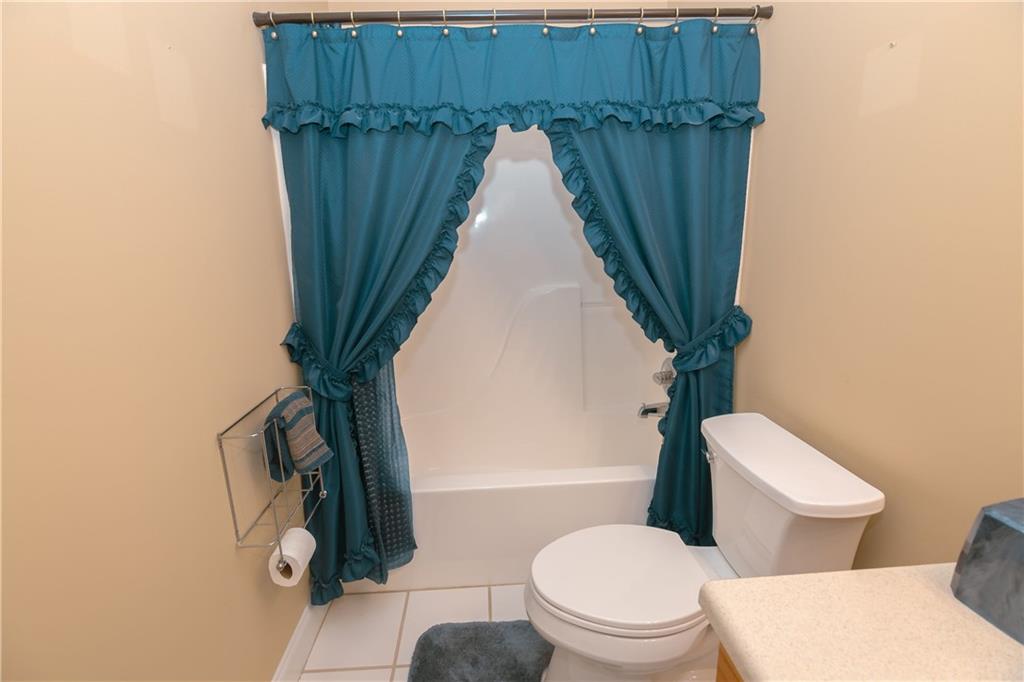 1200 Breckinridge Trail Winder, GA 30680 - Photo 26 of 37 a bathroom with a toilet and a shower curtain