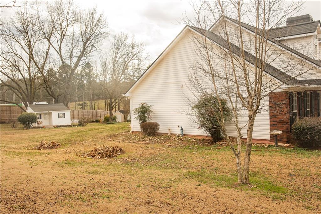 1200 Breckinridge Trail Winder, GA 30680 - Photo 29 of 37 a view of a yard covered in snow