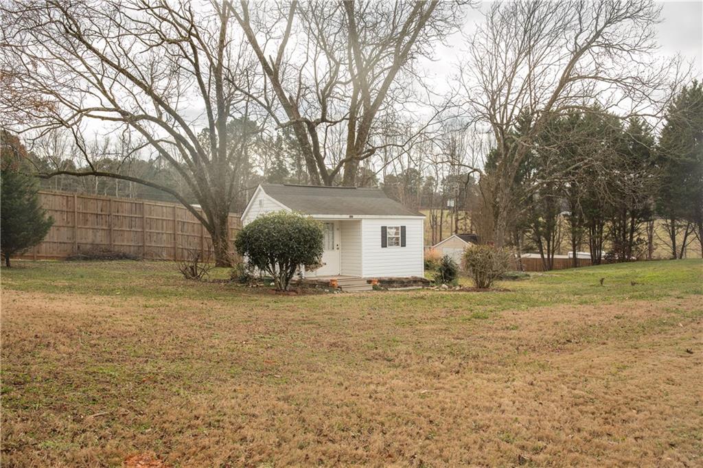 1200 Breckinridge Trail Winder, GA 30680 - Photo 30 of 37 a front view of a house with a yard and trees
