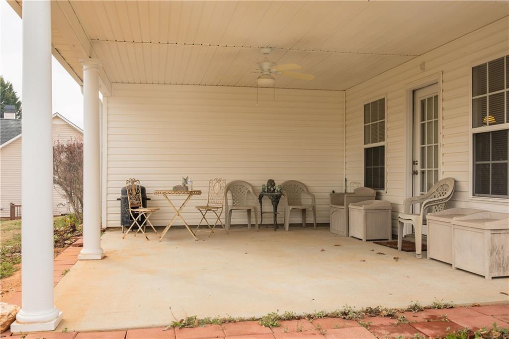 1200 Breckinridge Trail Winder, GA 30680 - Photo 34 of 37 a view of living room filled with furniture and floor to ceiling window
