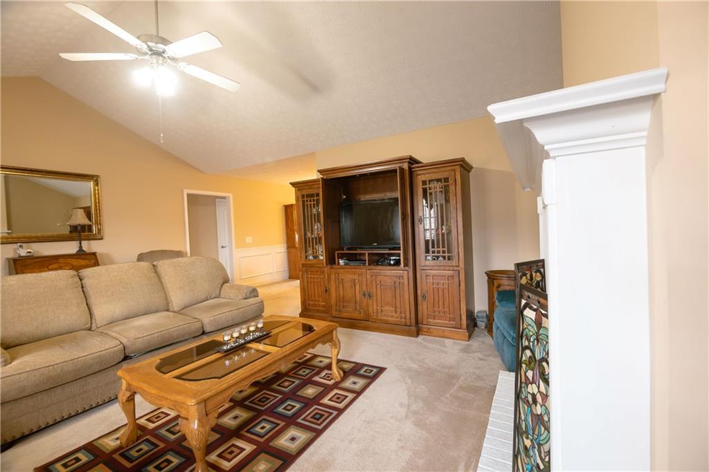 1200 Breckinridge Trail Winder, GA 30680 - Photo 5 of 37 a living room with furniture and a flat screen tv