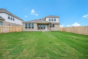 817 Paper Daisy Path Leander, TX 78641 - Photo 11 of 12 A private yard with new fencing offers ample space for outdoor enjoyment.