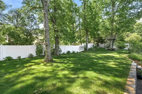 a backyard of a house with lots of green space