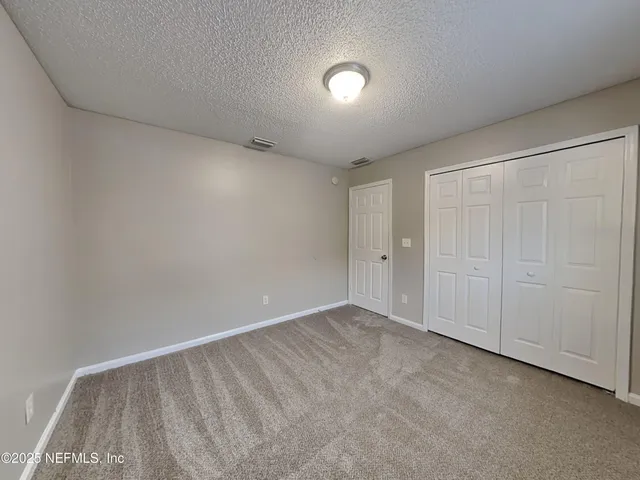 a bathroom with a toilet a sink a mirror and bathtub