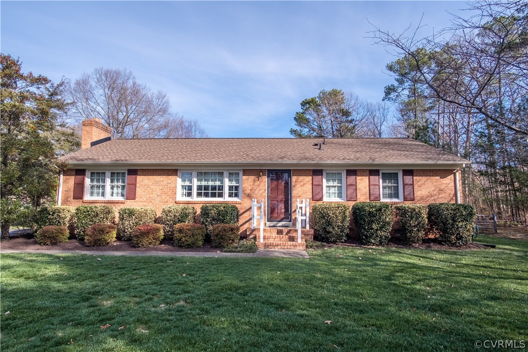 11500 Davelayne Road Midlothian, VA 23112 - Photo 1 of 23 a front view of a house with a garden