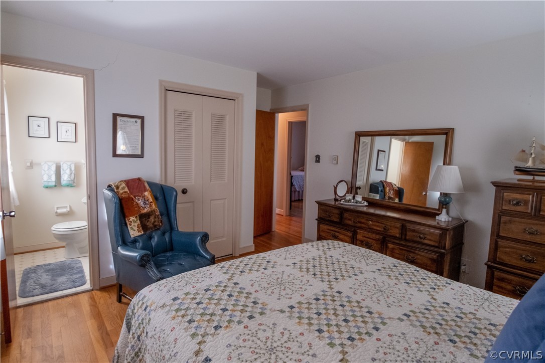 11500 Davelayne Road Midlothian, VA 23112 - Photo 12 of 23 a bedroom with a bed and wooden floor