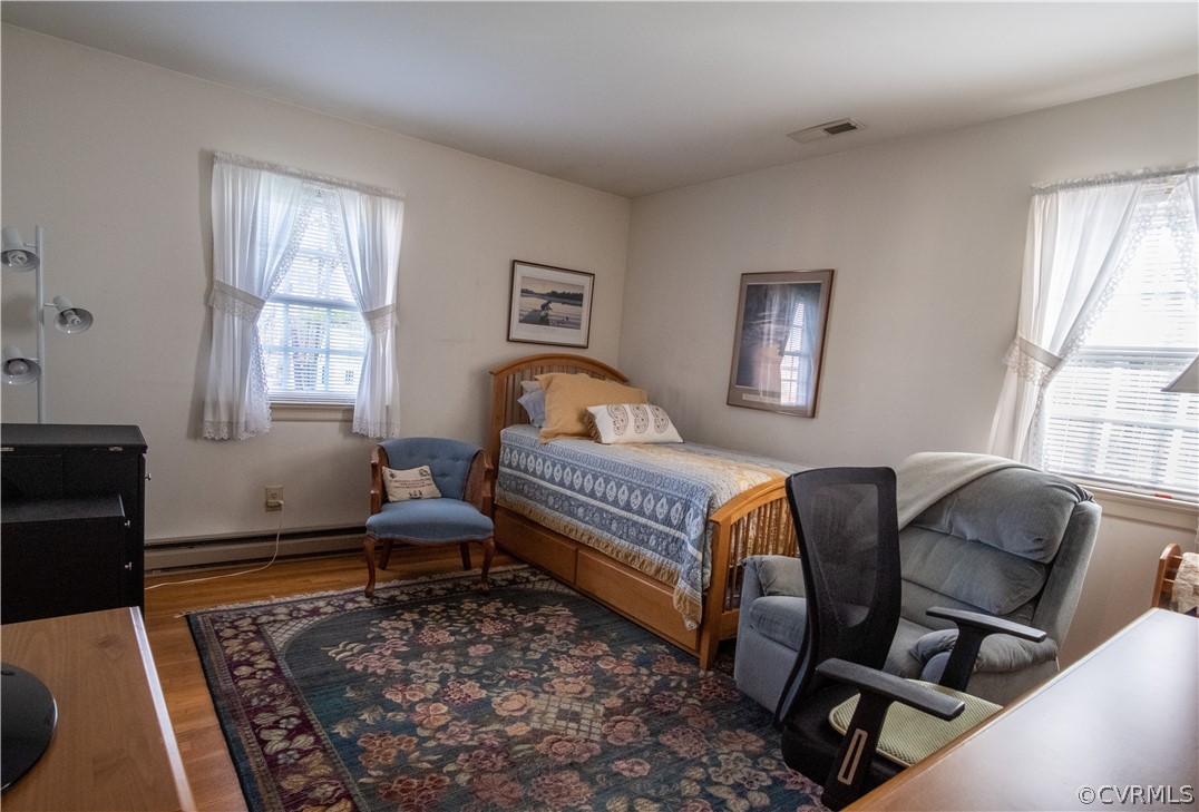 11500 Davelayne Road Midlothian, VA 23112 - Photo 14 of 23 a bedroom with a bed and wooden floor