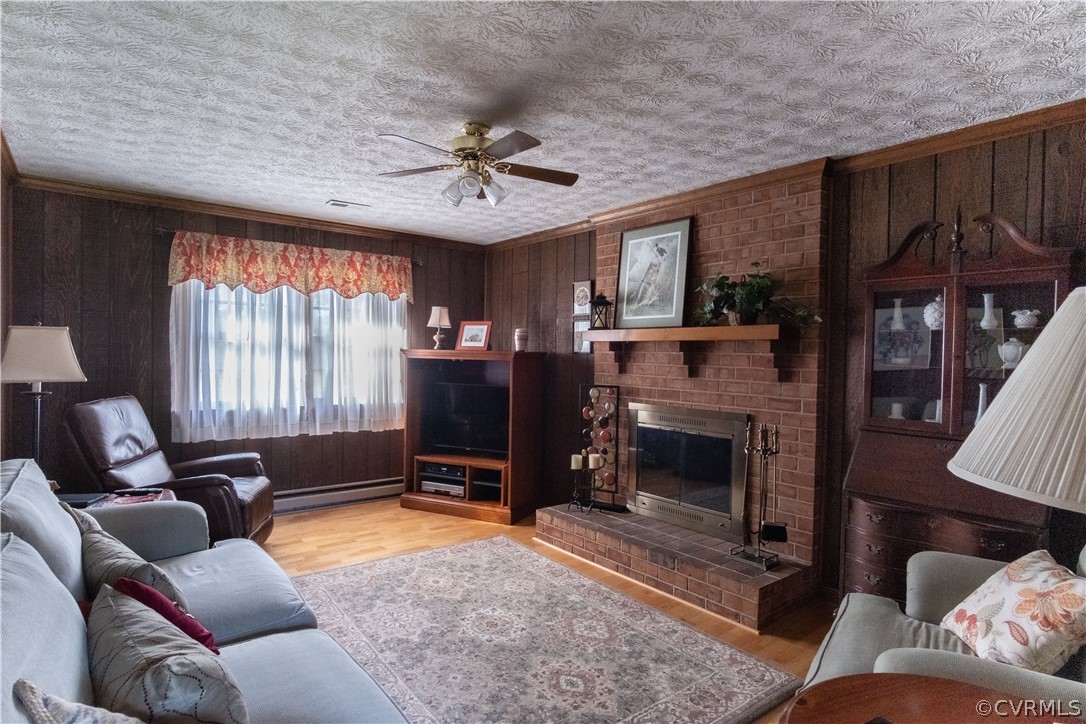 11500 Davelayne Road Midlothian, VA 23112 - Photo 16 of 23 a living room with furniture a window and a fireplace